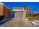 Attached gray garage with brick exterior at 8022 Talliho Dr, Indianapolis, IN 46256