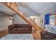 Living area showcasing hardwood floors, staircase, and natural light at 8022 Talliho Dr, Indianapolis, IN 46256
