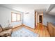 Bright loft space with hardwood floors, built-in shelving, and bathroom access at 8022 Talliho Dr, Indianapolis, IN 46256