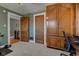 Home office with built-in wooden cabinets at 814 N Audubon Rd, Indianapolis, IN 46219