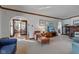 Bright living room with an archway leading to the dining area and hardwood floors at 814 N Audubon Rd, Indianapolis, IN 46219