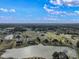 Aerial view showcasing a neighborhood with a lake and various houses at 8152 Cottonwood Dr, Martinsville, IN 46151
