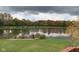 Picturesque autumn view of a backyard pond and dock, reflecting fall colors at 8152 Cottonwood Dr, Martinsville, IN 46151