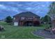 Brick home with deck, stairs, and a playground in the backyard at 8152 Cottonwood Dr, Martinsville, IN 46151