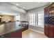 Basement bar with wine rack and large windows at 8152 Cottonwood Dr, Martinsville, IN 46151