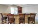 Basement wet bar with seating and wine storage at 8152 Cottonwood Dr, Martinsville, IN 46151