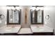 Elegant bathroom with double vanity and framed mirrors at 8152 Cottonwood Dr, Martinsville, IN 46151