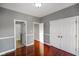 Bedroom with hardwood floors and access to other rooms at 8152 Cottonwood Dr, Martinsville, IN 46151