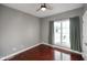 Bright bedroom with hardwood floors and a large window at 8152 Cottonwood Dr, Martinsville, IN 46151