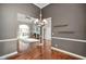 Formal dining room with hardwood floors and view to living room at 8152 Cottonwood Dr, Martinsville, IN 46151