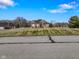 Brick home with a large grassy yard and paved road at 8152 Cottonwood Dr, Martinsville, IN 46151