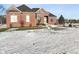 Red brick house with large windows and a snowy yard at 8152 Cottonwood Dr, Martinsville, IN 46151