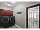 Laundry room with washer, dryer, and storage cabinets at 8152 Cottonwood Dr, Martinsville, IN 46151