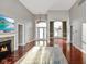 Bright living room featuring hardwood floors and large windows at 8152 Cottonwood Dr, Martinsville, IN 46151