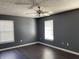 Simple bedroom with gray walls and dark hardwood floors at 8531 Friendship Ln, Indianapolis, IN 46217