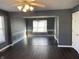 Dining room features dark hardwood floors, gray walls, and wainscoting at 8531 Friendship Ln, Indianapolis, IN 46217