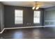 Spacious dining room with dark hardwood floors and gray walls at 8531 Friendship Ln, Indianapolis, IN 46217