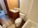 Bright bathroom with oak vanity, tub and shower at 8660 S Peoga Rd, Trafalgar, IN 46181