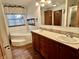 Well-appointed bathroom with a jetted tub, dual sinks, and ample counter space at 8660 S Peoga Rd, Trafalgar, IN 46181