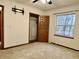 A serene bedroom with closet, and an open window overlooking a wooded area at 8660 S Peoga Rd, Trafalgar, IN 46181