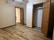 Bedroom featuring wood-look flooring, and closet at 8660 S Peoga Rd, Trafalgar, IN 46181