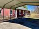 Attached carport providing shelter for vehicles at 8660 S Peoga Rd, Trafalgar, IN 46181