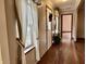 Welcoming entryway with decorative curtains, wreath-adorned door, and a table, offering a warm entrance at 8660 S Peoga Rd, Trafalgar, IN 46181