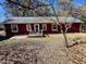 Cozy home with a inviting porch, surrounded by nature with mature trees at 8660 S Peoga Rd, Trafalgar, IN 46181