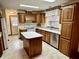 Well-lit kitchen with cabinets, countertops, and appliances at 8660 S Peoga Rd, Trafalgar, IN 46181
