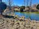 Picturesque pond with clear water surrounded by trees at 8660 S Peoga Rd, Trafalgar, IN 46181