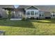 Spacious backyard with lawn, pergola, and sunroom at 8737 Twain Ln, Indianapolis, IN 46239