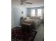 Bedroom with a floral-print bed and barn door at 8737 Twain Ln, Indianapolis, IN 46239