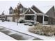 Two-story home with snow-covered front yard and attached garage at 8737 Twain Ln, Indianapolis, IN 46239