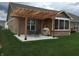 Backyard patio with pergola, seating, and grill at 8737 Twain Ln, Indianapolis, IN 46239
