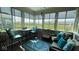 Relaxing sunroom with view, wicker furniture, and pillows at 8737 Twain Ln, Indianapolis, IN 46239
