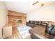 Living room with brick fireplace and leather sectional sofa at 9876 Woodbriar Ln, Carmel, IN 46280