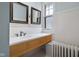 Bathroom with wooden vanity and decorative mirrors at 1023 Franklin St, Columbus, IN 47201