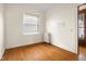 Bright bedroom with hardwood floors and large window at 1023 Franklin St, Columbus, IN 47201