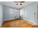Bedroom with hardwood floors, ceiling fan and door to outside at 1023 Franklin St, Columbus, IN 47201
