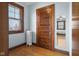 Bright bedroom with hardwood floors, window and closet at 1023 Franklin St, Columbus, IN 47201