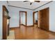 Hardwood floor bedroom with fireplace and access to hallway and closets at 1023 Franklin St, Columbus, IN 47201