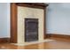 Ornate fireplace with yellow tile and decorative iron grate at 1023 Franklin St, Columbus, IN 47201