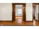 View through pocket doors showing hardwood floors at 1023 Franklin St, Columbus, IN 47201