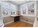 Kitchen boasts hardwood floors and large windows at 1023 Franklin St, Columbus, IN 47201