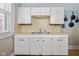 White kitchen with double sink and ample counter space at 1023 Franklin St, Columbus, IN 47201