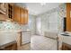 Kitchen with light oak cabinets and tiled floor at 1023 Franklin St, Columbus, IN 47201
