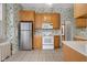 Kitchen with oak cabinets and stainless steel appliances at 1023 Franklin St, Columbus, IN 47201