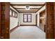 Spacious living room with wood beams and stained glass at 1023 Franklin St, Columbus, IN 47201