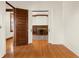 Hardwood floors and pocket doors leading to living room at 1023 Franklin St, Columbus, IN 47201
