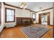 Living room with hardwood floors, fireplace, built-ins at 1023 Franklin St, Columbus, IN 47201